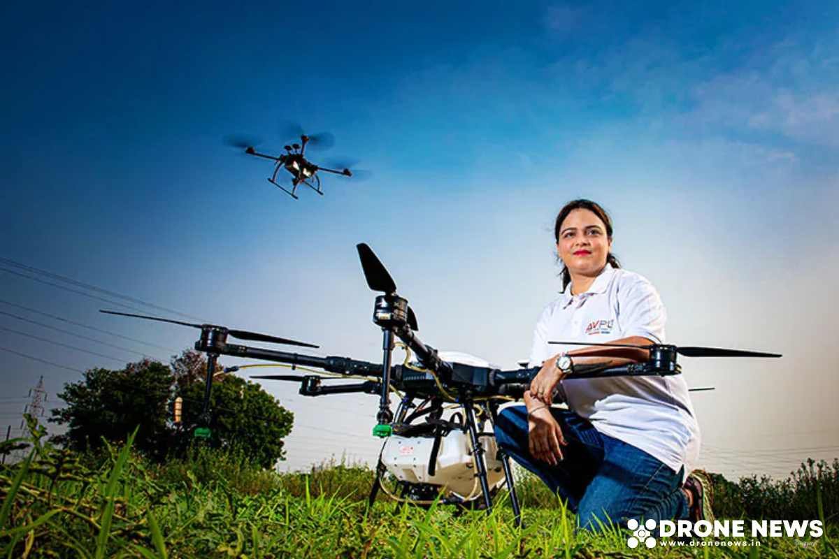 Viraj drone of AVPL in field. Preet Sandhu sitting beside the drone