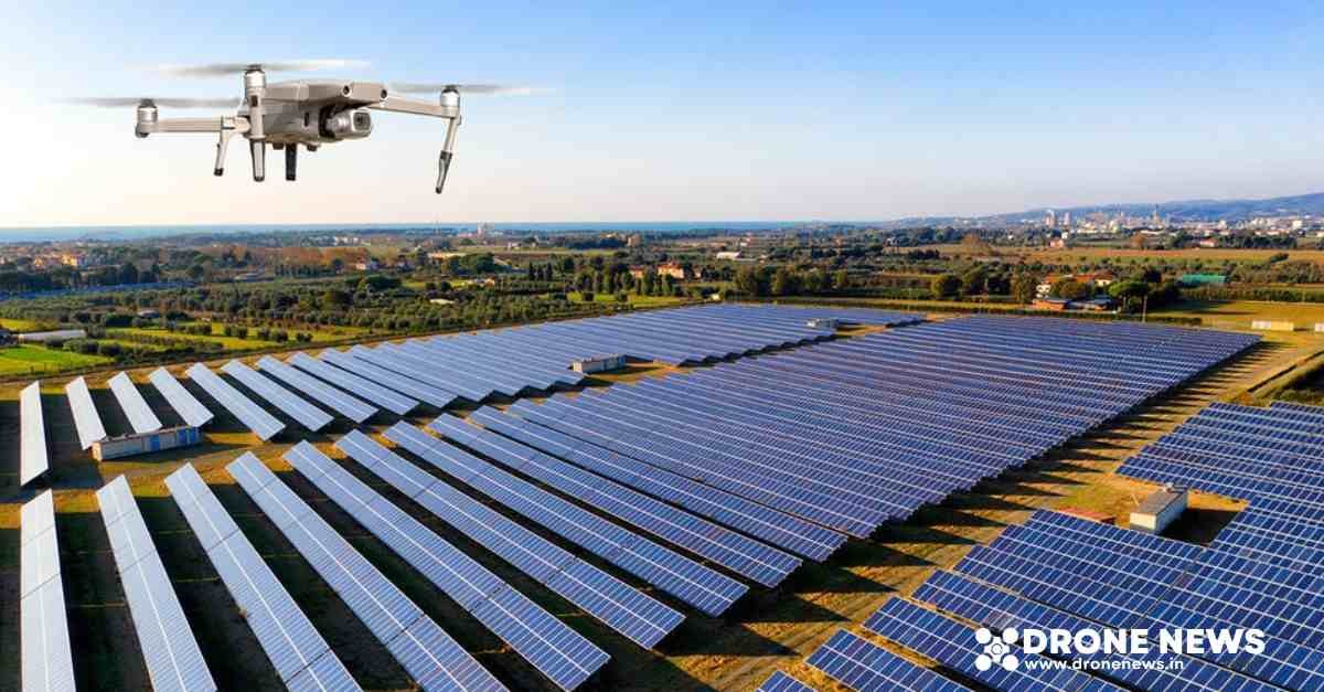 A drone flying over a solar establishmenr